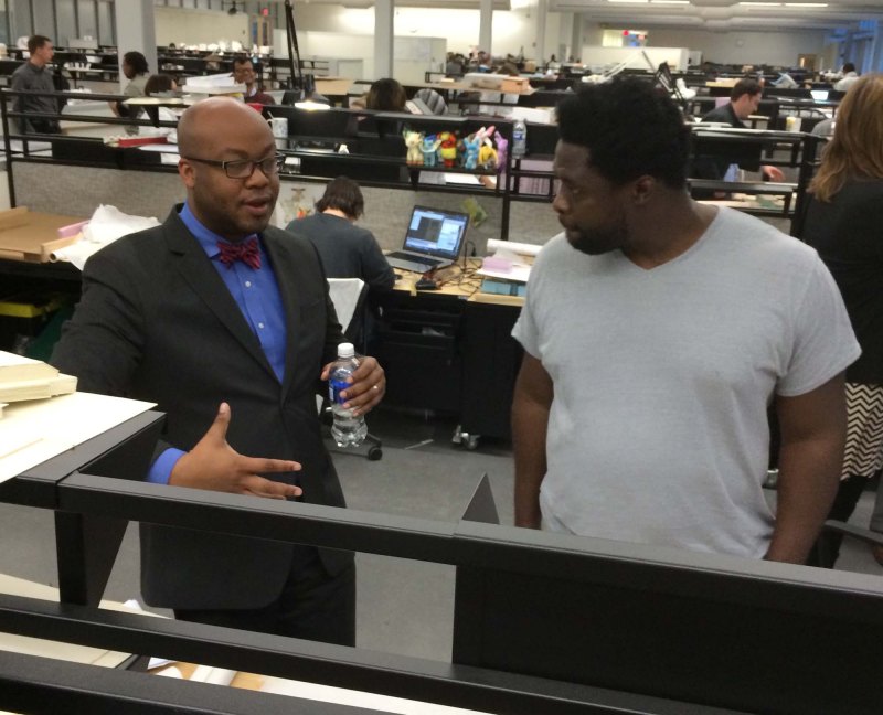 Charles Davis speaking with student at Morgan State